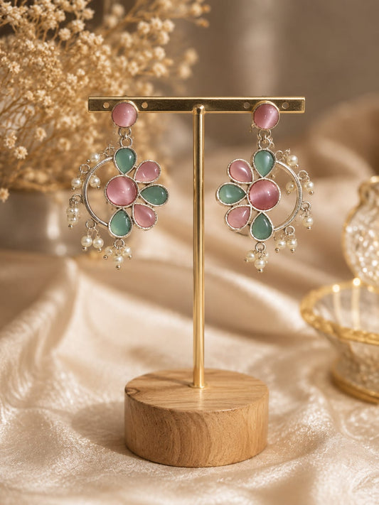 Silver-tone floral chandbali earrings with pink and mint cat's-eye stones and a white pearl fringe